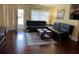 Cozy living room with comfortable seating and a bright, airy feel from the window at 425 Highland Ct, Dunedin, FL 34698