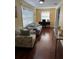 Home office with two windows providing natural light and comfortable furniture for work or relaxation at 425 Highland Ct, Dunedin, FL 34698