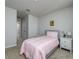Bedroom with neutral walls, carpet flooring and a twin bed with a decorative nightstand at 4272 Cloud Hopper Way, Lutz, FL 33559