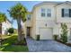 Charming townhouse features a one-car garage, beautifully landscaped front yard, and a welcoming entrance at 4272 Cloud Hopper Way, Lutz, FL 33559
