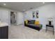 Open living area featuring carpet floor, a sofa, and modern decor at 4272 Cloud Hopper Way, Lutz, FL 33559