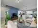 Stylish living room and kitchen area with a modern decor and ample natural light at 4272 Cloud Hopper Way, Lutz, FL 33559