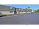 Apartment building exterior showing the parking lot with designated parking spots and well-maintained landscaping at 4315 Aegean Dr # 130C, Tampa, FL 33611