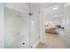 Modern bathroom with a glass-enclosed shower and views of the main bedroom at 434 Arch Ridge Loop # 434, Seffner, FL 33584