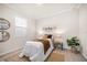 Inviting bedroom with warm tones, comfortable bedding, and ample natural light creating a relaxing space at 434 Arch Ridge Loop # 434, Seffner, FL 33584