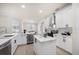 Contemporary kitchen featuring white cabinets, a center island, modern appliances, and lots of natural light at 434 Arch Ridge Loop # 434, Seffner, FL 33584