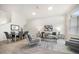 Bright and airy living room boasts neutral tones, modern decor, and a cozy seating area with dining space at 434 Arch Ridge Loop # 434, Seffner, FL 33584