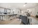 Bright open-concept living room featuring modern decor and a seamless flow into the kitchen at 434 Arch Ridge Loop # 434, Seffner, FL 33584