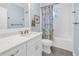 Bright bathroom featuring a vanity with marble countertops and a shower-tub combination at 436 12Th Ne Ave, St Petersburg, FL 33701