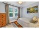 Well-lit bedroom with hardwood floors, neutral decor, and a cozy atmosphere at 436 12Th Ne Ave, St Petersburg, FL 33701