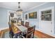 Elegant dining room with chandelier, built-in shelving, seamlessly connected to the adjacent kitchen at 436 12Th Ne Ave, St Petersburg, FL 33701