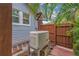 Exterior generator alongside a wooden fence and wall of a home at 436 12Th Ne Ave, St Petersburg, FL 33701