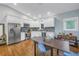 Bright, open kitchen with stainless steel appliances, granite countertops, and dining area at 436 12Th Ne Ave, St Petersburg, FL 33701