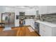 Bright kitchen features white cabinets, stainless steel appliances, and stylish backsplash at 436 12Th Ne Ave, St Petersburg, FL 33701