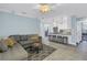 Comfortable living room with an open floor plan and views of the modern kitchen at 436 12Th Ne Ave, St Petersburg, FL 33701