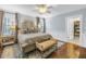 Cozy main bedroom with a large bed, hardwood floors, and ample natural light at 436 12Th Ne Ave, St Petersburg, FL 33701