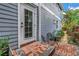 Brick patio with seating area and access to the main house. Plants in foreground at 436 12Th Ne Ave, St Petersburg, FL 33701