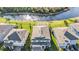 Aerial view of home and surrounding landscape, showcasing lush greenery and a scenic waterfront at 4607 Ballantrae Boulevard, Land O Lakes, FL 34638