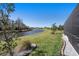 Green backyard overlooking the lake, providing a serene and private setting at 4607 Ballantrae Boulevard, Land O Lakes, FL 34638