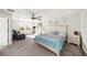 Bedroom with carpet, light coloured walls, white drawers, bed, and large windows for ample natural light at 4607 Ballantrae Boulevard, Land O Lakes, FL 34638