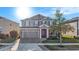 Charming two-story home with well-manicured lawn, inviting curb appeal, and a two car garage at 4607 Ballantrae Boulevard, Land O Lakes, FL 34638