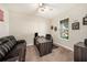 Cozy home office featuring a dark wood desk, comfortable seating, and ample natural light at 4607 Ballantrae Boulevard, Land O Lakes, FL 34638