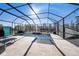 Screened-in pool with ample patio space, perfect for outdoor entertaining with water view at 4607 Ballantrae Boulevard, Land O Lakes, FL 34638