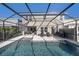 Back of house with a screened in pool and patio set for outdoor enjoyment at 4607 Ballantrae Boulevard, Land O Lakes, FL 34638
