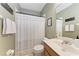 Bathroom featuring a tub and shower, neutral color palette, and vanity sink at 4712 Trout River Xing, Ellenton, FL 34222