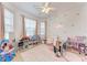 Bright bedroom with play area, shelves of toys, and lots of natural light at 4712 Trout River Xing, Ellenton, FL 34222