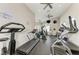 A complete gym with multiple machines, ceiling fans, and inspirational decor at 4712 Trout River Xing, Ellenton, FL 34222