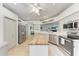 Modern kitchen with butcher block island, stainless steel appliances, and abundant white cabinetry at 4712 Trout River Xing, Ellenton, FL 34222