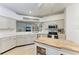 Bright kitchen with white cabinets, butcher block island, stainless steel appliances, and ample countertop space at 4712 Trout River Xing, Ellenton, FL 34222
