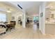 Open-concept living spaces featuring hardwood floors, archways, and seamless flow between dining, living, and kitchen areas at 4712 Trout River Xing, Ellenton, FL 34222