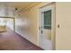 Condo entrance with a white door featuring a glass window and a doorbell with camera at 4750 Cove Cir # 706, St Petersburg, FL 33708