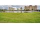 Scenic view of condo buildings overlooking the lake and community lawn at 4750 Cove Cir # 706, St Petersburg, FL 33708
