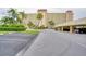 Beautiful condo building with palm trees and covered parking at 4750 Cove Cir # 706, St Petersburg, FL 33708
