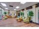 Spacious lobby with wood flooring, plants, and comfortable seating areas at 4750 Cove Cir # 706, St Petersburg, FL 33708
