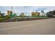 Well-maintained tennis court surrounded by lush landscaping and apartment buildings, providing recreational opportunity at 4750 Cove Cir # 706, St Petersburg, FL 33708
