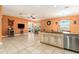 Open-concept kitchen with granite countertops, stainless steel appliances, and seamless transition to living area at 5843 Justicia Loop, Land O Lakes, FL 34639