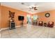 Cozy living room area with media center, wine storage, and ample seating for relaxation at 5843 Justicia Loop, Land O Lakes, FL 34639