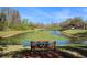 Beautiful pond view from backyard with tranquil water and lush greenery for relaxation at 5843 Justicia Loop, Land O Lakes, FL 34639