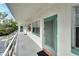 White exterior with colorful front doors and a staircase leading to the entrance at 5850 21St N St # 18, St Petersburg, FL 33714