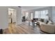 Open-concept living space with hardwood floors, dining area, and a cozy living room setup at 5850 21St N St # 18, St Petersburg, FL 33714