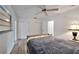 Spacious main bedroom with wood floors, a ceiling fan, and closet space at 5850 21St N St # 18, St Petersburg, FL 33714