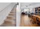 Open living room view from the stairwell, with hardwood floors and neutral tones at 5922 Bayside Key Dr, Tampa, FL 33615