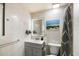 Contemporary bathroom featuring a vanity with modern fixtures, a mirror with lights, and a toilet at 1012 Greenleaf Way, Tarpon Springs, FL 34689