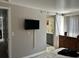 Neutral bedroom with a barn door to the bathroom at 1012 Greenleaf Way, Tarpon Springs, FL 34689