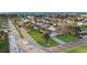 Lovely aerial view of a waterfront neighborhood with palm trees, well-manicured lawns, and serene streets at 111 22Nd St, Belleair Beach, FL 33786
