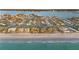 Gorgeous aerial view of a coastal community with pristine beaches and clear turquoise waters at 111 22Nd St, Belleair Beach, FL 33786